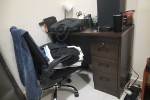 Double bed, tv stand, tv and a work station
